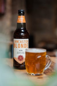 Handle mug filled with Lancaster Blonde beer.