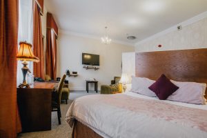 Hotel Room - Bed, table & TV