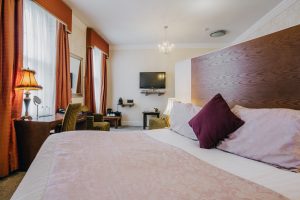 Hotel Room - Bed, table & TV