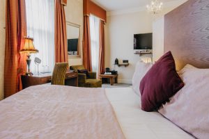 Hotel Room - Bed, mirror, table & TV