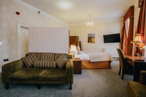 Hotel Room - Bed, table and couch